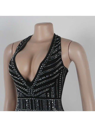 Mono con espalda descubierta, encaje y cuello halter adornado