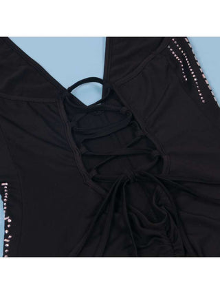 Mono con espalda descubierta, encaje y cuello halter adornado